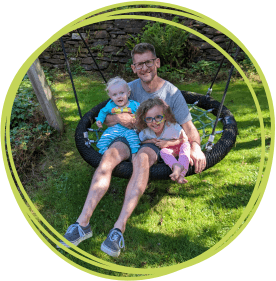 Dad Russ with Rosa and Beau on the swing at Little Bridge House